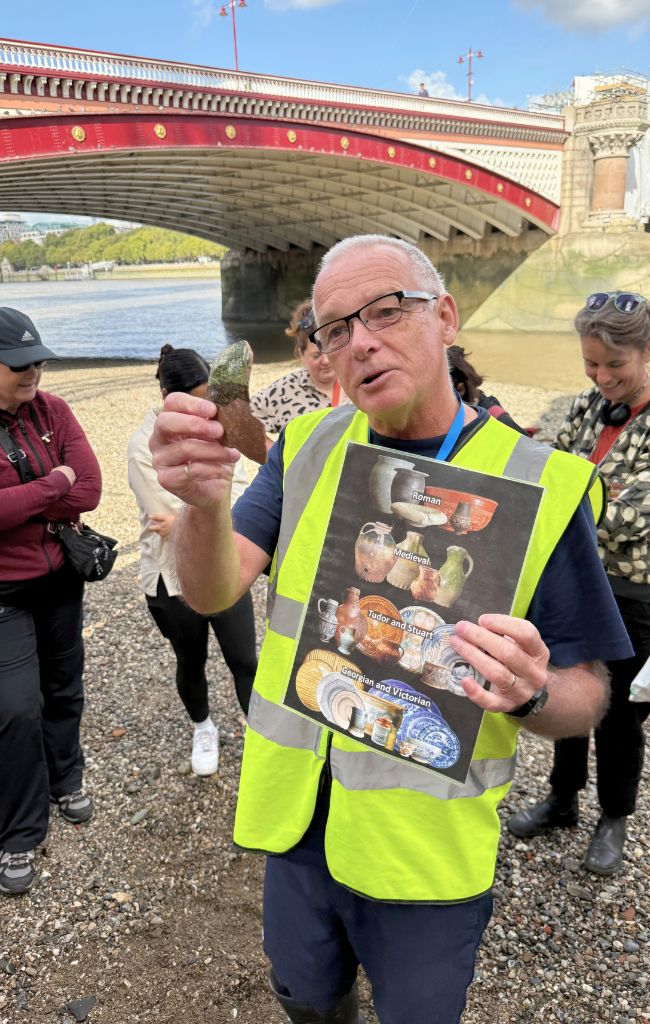 Sean, our Thames Explorer Trust guide, mudlarking in London
