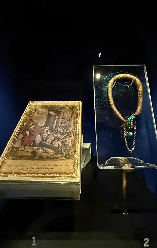 A box showing Florence and the nurses arriving in the Crimea and a bracelet made out of hair on display at The Florence Nightingale Museum, London